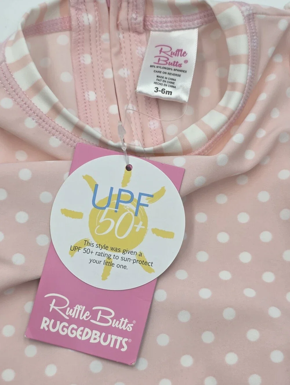 NEW RuffleButts baby girl pink rashguard swimsuit size 3-6 months